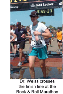 Dr. Weiss crosses the finish line at the Rock & Roll Marathon